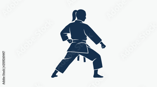 Martial artist stands in a low fighting pose wearing a traditional karate uniform.