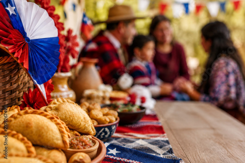 Chilean Independence Day celebration with empanadas and decor. Family gathering concept during Fiestas Patrias in Chile.