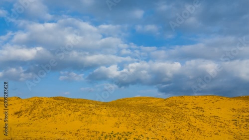 dry sand desert under a blue sky  time lapse scene