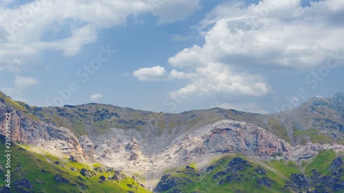 green mountain backbone on a cloudy sky time lapse scene