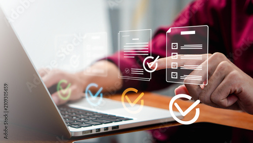 approval,efficiency,signature,policy,Business professional reviewing digital checklist documents on a laptop with electronic approval, compliance verification and document management workflow.