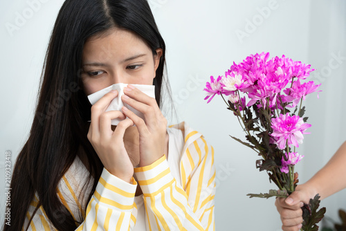 Quadro su tela Flower pollen allergy, Asian girl rejects flowers, allergic to wild flowers or b