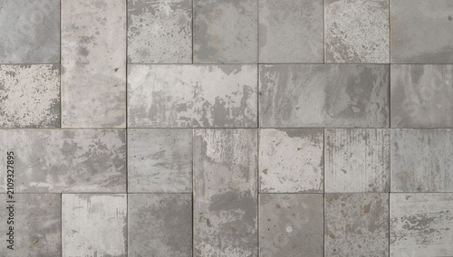 Textured concrete tiles with a distressed, weathered appearance in a rectangular arrangement