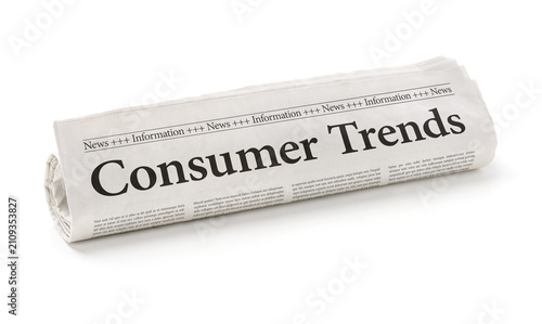 Rolled newspaper with the headline Consumer Trends