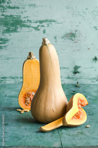 Whole and a sliced butternut squashes