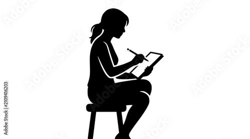 Silhouette of a woman artist drawing on a tablet with a stylus