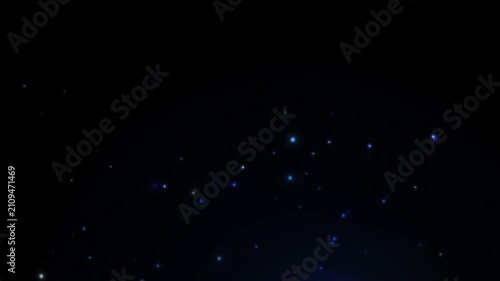 Atmospheric subtle blue and white particles slowly floating upwards in a deep dark background