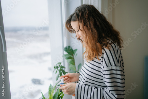 Bild auf Leinwand Woman feeling nervous and anxious while holding a pregnancy test, anxiously wait
