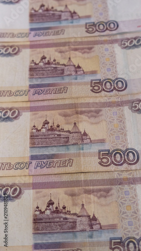Canvas Print Vertical close up photograph of several five hundred russian ruble banknotes ove