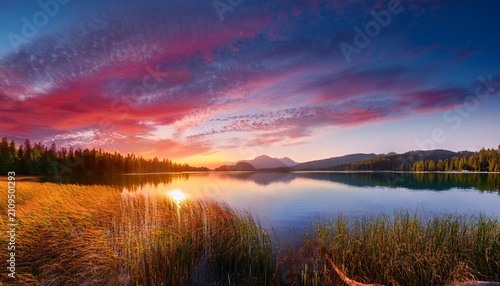 Peaceful Lake Landscape With Colorful Sunset Sky And Clouds