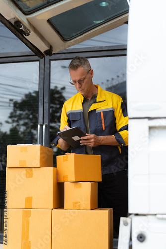 delivery man work in truck for checking the product in the truck, concept ecommerce.