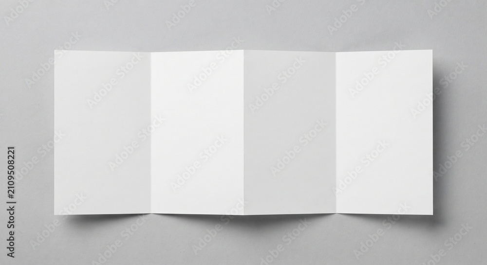 Naklejka premium Top-down view of a blank white four-panel accordion fold brochure laid flat on light grey textured background with soft shadows.