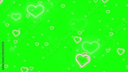 Hearts float gently across a bright green screen to create a romantic visual effect.