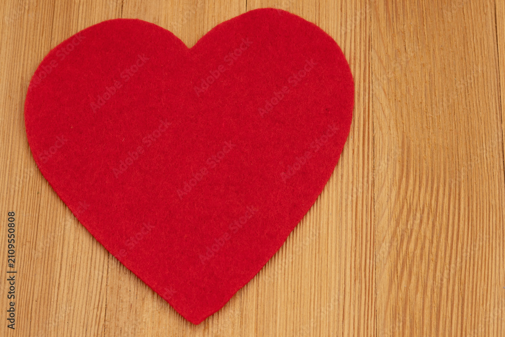 Fototapeta premium Blank red heart on a wood desk for romance and dating