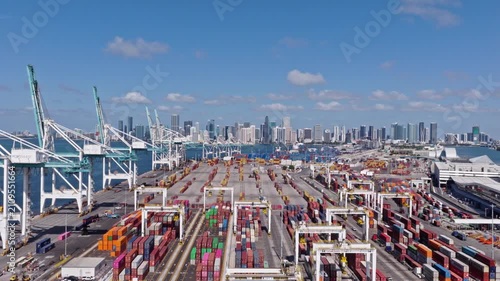 Miami, Florida, USA - May 21, 2025: Freight container cargo. Port of Miami. Container port loading. Export and import. Cargo business. Cargo services with container in Miami port terminal