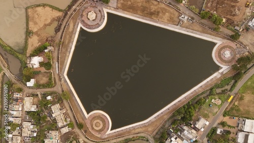 Foto Top Down Aerial Drone View of Urban Lake Reservoir with Geometric Embankment and