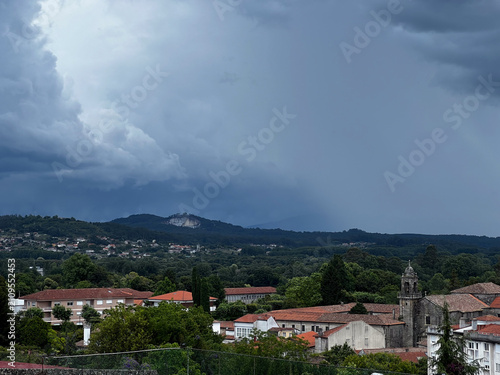 Dark storm clouds over landscape in Tui on Camino de Santiago