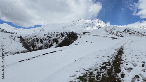 Panoramic view of snow covered Koruldi ridge in Svaneti Georgia, majestic mountain peaks, alpine adventure, hiking trails in winter