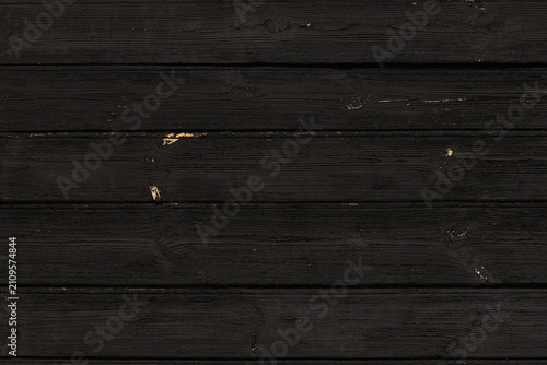 Black background. Texture of old charred wood.