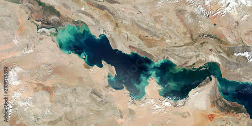 Detailed satellite imagery of Persian Gulf coastline with turquoise water patterns.