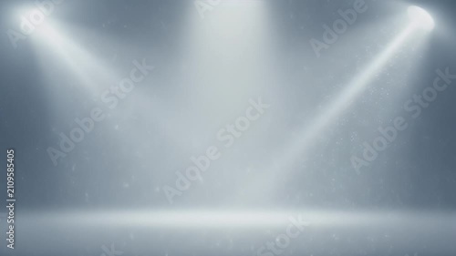 Empty stage with bright spotlights and glowing dust particles illuminated background for performance or presentation