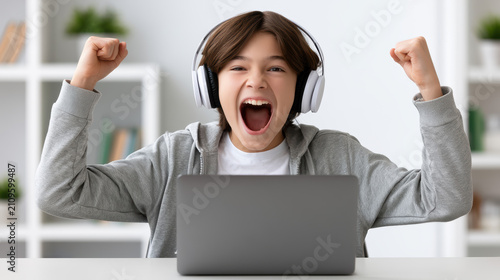 Portrait of a Happy Boy Attending Online Classes with Laptop