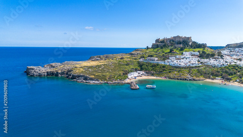 Panoramic aerial view of Acropolis of Lindos medieval fortress and traditional white village on Rhodes island Greece