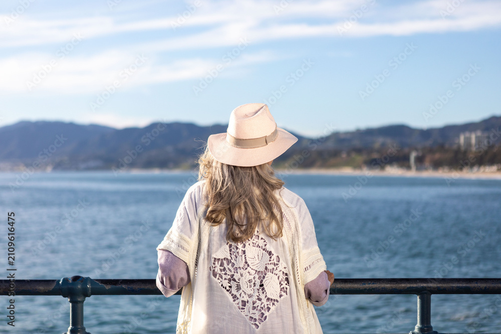 Fototapeta premium Woman enjoying scenic ocean view