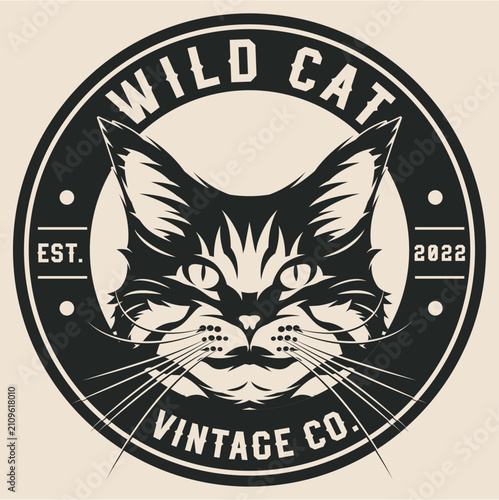 Vintage style black and cream cat face logo with whiskers in a circular badge with western serif font text Wild Cat and Vintage Co.