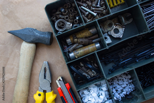 Canvas Print Hand tools and organizer box with screws and bolts flat lay