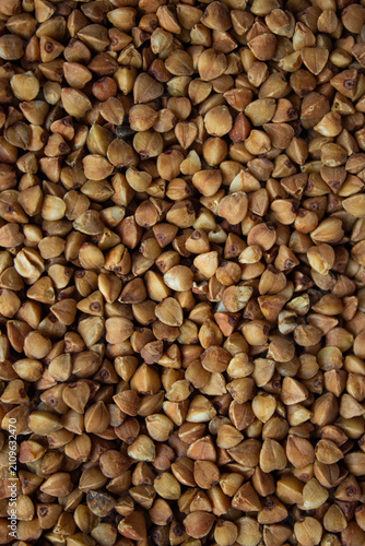 Canvastavla Raw roasted buckwheat groats texture background full frame top view food photography