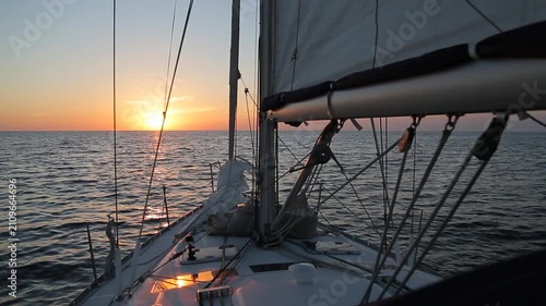 Sailing Yacht Deck Facing Golden Sunset on Mediterranean Sea in Corsica