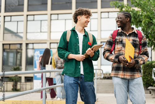 College Student friends Walking University staircase talking and laughing after lectures and exams