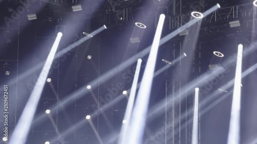 Concert stage lights creating dramatic illumination effect