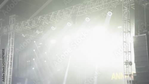 Bright concert spotlights illuminating outdoor festival stage