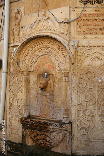 Jaisalmer city nicknamed The Golden City in Rajasthan, India. Indian architecture, architectural Rajasthani landmark, sight. Beautiful ornamental facade, exterior detail. Building, decor