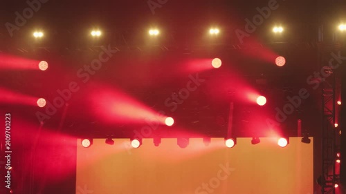 Professional stage lighting system with red spotlights at live event