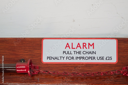 Tableau sur toile Emergency alarm pull chain with sign ALARM PULL THE CHAIN PENALTY FOR IMPROPER U