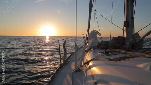 Sailing Yacht Deck Facing Golden Sunset on Mediterranean Sea