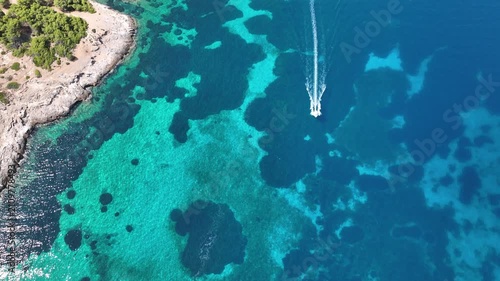 Dynamic Top Down Drone Shot Over Turquoise Bay Off Agistri with Fast Boat, Superyacht on Long Line and Catamaran in Distance