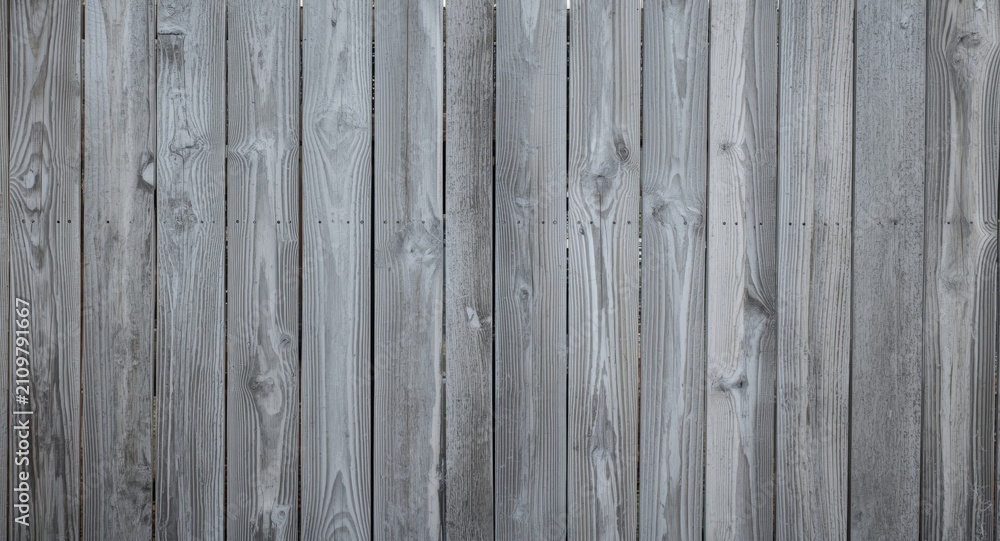 Fototapeta premium Weathered Wooden Fence Panels in Soft Gray Tones