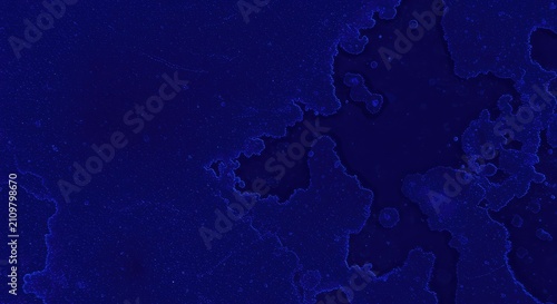 Abstract background of deep indigo blue dye spreading across a textured surface creating a messy, vibrant pattern ,diffusion ,background ,dye