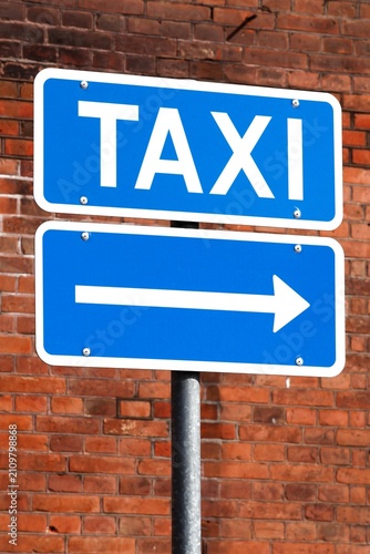 Blue taxi direction sign in Denmark