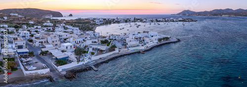 Panoramic aerial view of Pollonia village and bay at sunset, Milos island, Greece