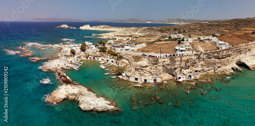 Panoramic aerial view of Mandrakia fishing village with syrmata, Milos island, Greece