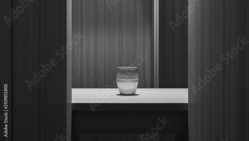 Foto Glass Vase on Minimalist Table Surrounded by Wooden Panels in Soft Light