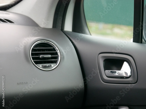 Foto Car interior with air vent and door handle