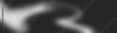 Fotografie Black grainy gradient background, dark gray white monochromatic noise texture ba