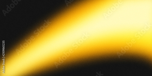 Фотография Golden grainy light streak on black background abstract
