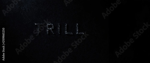 Принти на полотні Text TRILL Etched in Dark Surface with Subtle Texture